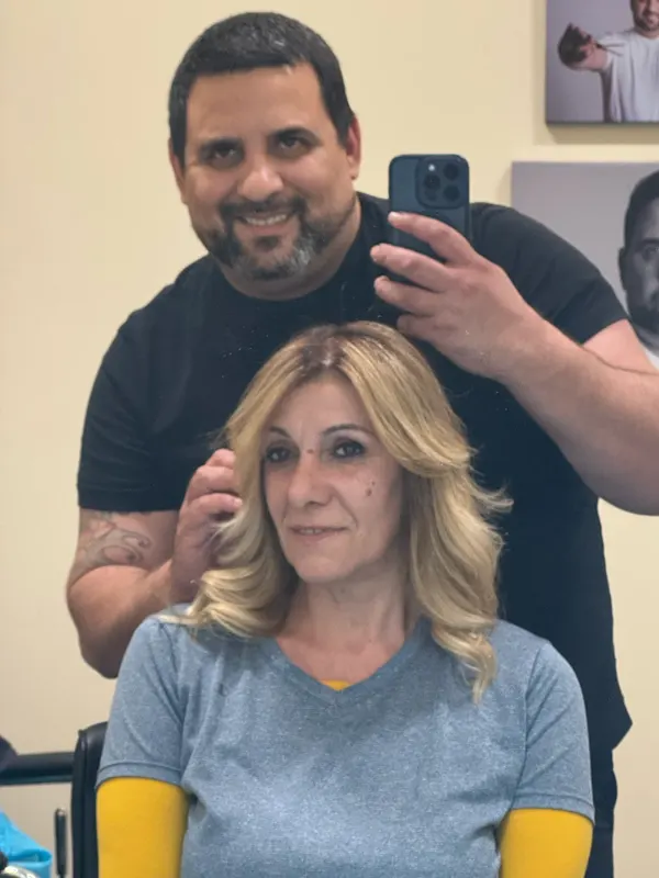 Golden blonde blown out in feathered layers, checked in the mirror with Verlano