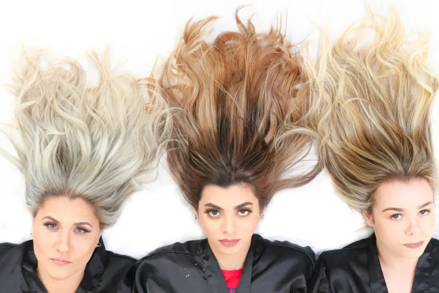 The same three heads of color laid out flat, showing every shade from root to end