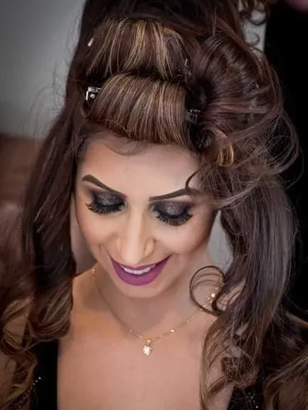 Volume half up being set, the curls still pinned