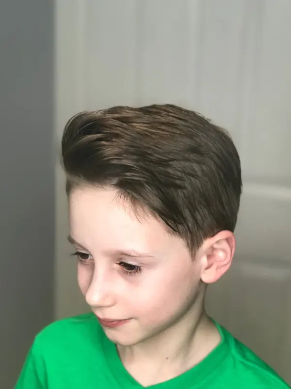 Boys cut, side parted and tapered to sit down without product