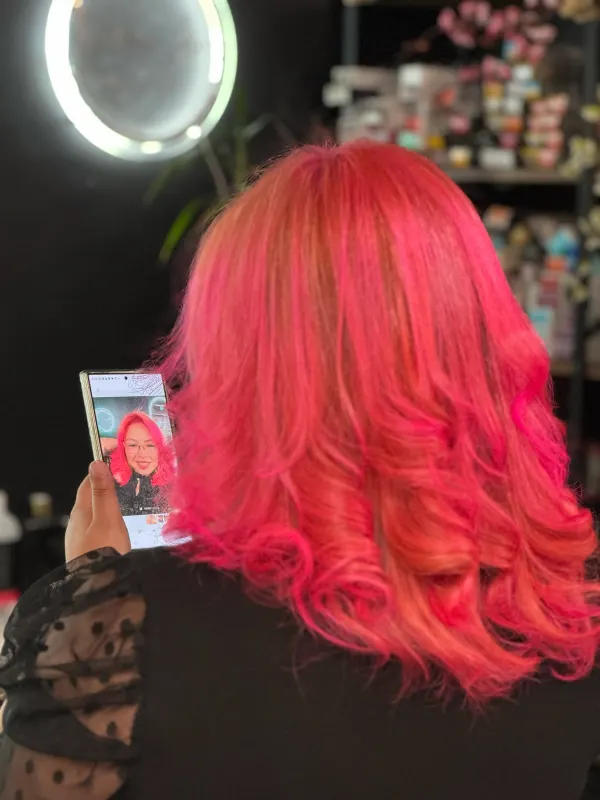Magenta red set in curls, seen from the back
