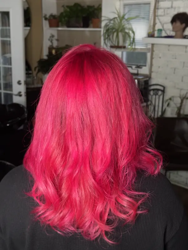 Bright pink taken from the root down and finished in a soft wave